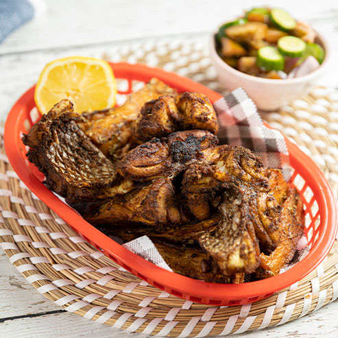 Red basket of Indian inspired fish and chips