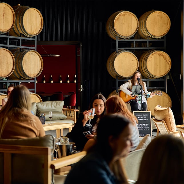 live music in the barrells with people sitting around drinking