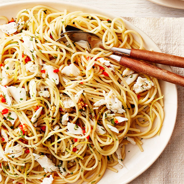 Plate of linguine con granchio garnished with parsley