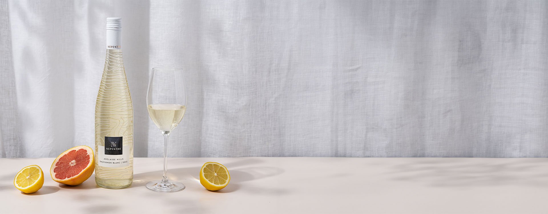 Nepenthe Ascend Sauvignon Blanc with assorted citrus fruits