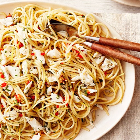 Linguine Con Granchio pasta is bowl with utensils