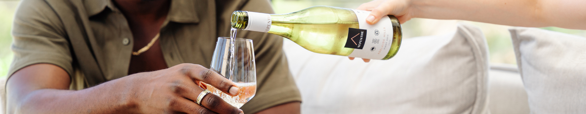 Nepenthe Elevation Pinot Gris Wine Pour Glass being Held